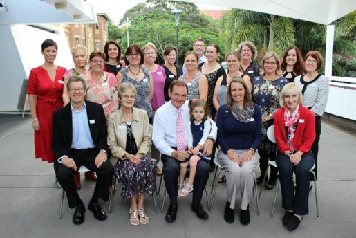 A group of people in Australia sitting for a photo