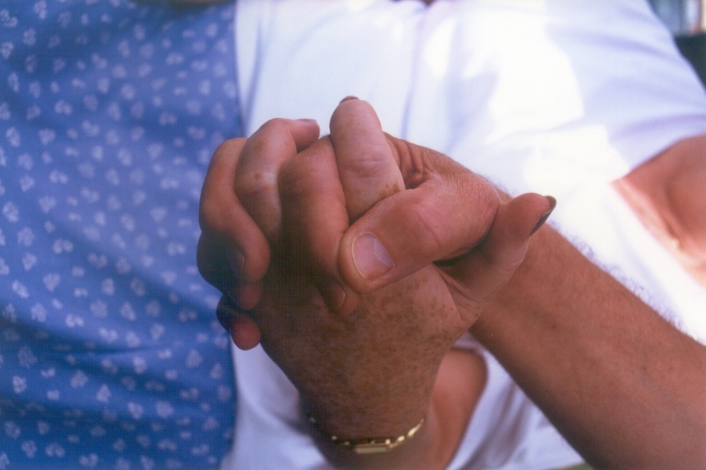 Two hands clasped together