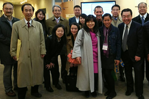 A group of people at the Japan seminar gather for a group photo